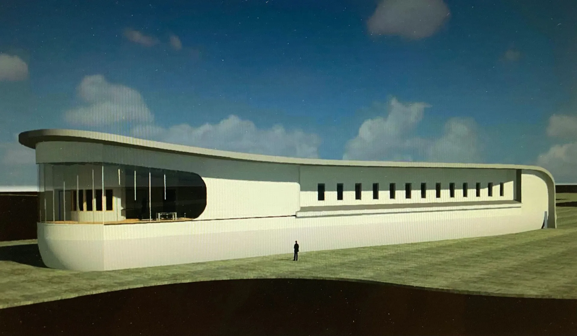OPA HANGAR. Long low exterior rendering with a curved white roof, glazed end, and repeated narrow openings.